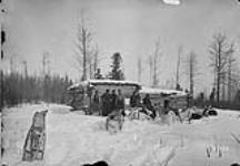 [Exploratory Survey between Great Slave Lake and Hudson Bay, Districts of Mackenzie & Keewatin.] A Halt for lunch at a hunter's camp