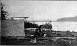 [Indian Treaty No. 9] The camp barber at Flying Post, Ont 1906