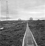 [Boardwalk leading to the radar station, Iqaluit, Nunavut]. [between 1956-1960]