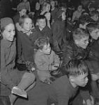 Children's Art Classes, Lismer's, group of children seated on the floor. [between 1939-1951].