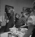 Children's Art Classes, Lismer's, children looking at art work. [between 1939-1951].