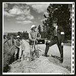 Mr. Maag interviews men at Grand Forks putting in an irrigation pipe for the farmer for whom they work  [1945/06/16-1945/06/28]