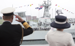 [Her Majesty Queen Elizabeth II and Prince Philip salute and wave from the HMCS St. John's during a fleet review of 28 Canadian and foreign warships at anchor in Bedford Basin and Halifax Harbor] 29 June 2010
