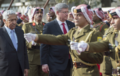 [Prime Minister Stephen Harper, accompanied by Prime Minister Abdullah Ensour, inspects the honour guard during a welcoming ceremony at the Prime Ministry in Amman, Jordan] 23 January 2014