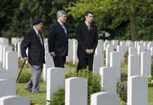 [Prime Minister Stephen Harper, D-Day veteran Phil LeBreton, 87, of Montréal and youth delegate Christopher Bernard, 17, of Gatineau, Quebec, walk through the Canadian military cemetery in Beny-sur-Mer, France] 6 June 2009