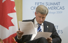 [Prime Minister Stephen Harper looks over his notes before bilateral meetings at the Summit of the Americas in Port of Spain, Trinidad and Tobago] 18 April 2009