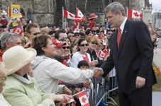 [Prime Minister Stephen Harper shakes hands during Canada Day celebrations on Parliament Hill in Ottawa] 1 July 2007