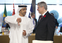 [United Arab Emirates Foreign Minister Abdullah bin Zayed Al Nahyan chats with Prime Minister Stephen Harper prior to a working session at the G20 Summit in Cannes, France] 3 November 2011