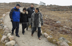 [Prime Minister Stephen Harper walks with local candidate Leona Aglukkaq and Nunavut Premier Paul Okalik in Iqaluit, Nunavut] 20 September 2008