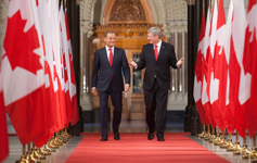[Prime Minister Stephen Harper and Donald Tusk, Prime Minister of the Republic of Poland, walk through the Hall of Honour to a joint media availability on Parliament Hill in Ottawa] 14 May 2012