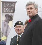 [Prime Minister Stephen Harper and the Chief of Defense Staff General Walter Natynczyk wait for the march past during the Battle of Vimy Ridge anniversary ceremony at the National War Monument in downtown Ottawa] 9 April 2010