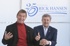 [Prime Minister Stephen Harper and Rick Hansen celebrate the 25-year anniversary of the Man in Motion World Tour at the Blusson Spinal Cord Centre in Vancouver, British Columbia] 21 March 2010