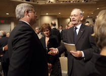[Prime Minister Stephen Harper chats with former Prime Minister Jean Chrétien at the state funeral of Jack Layton, leader of Her Majesty's Loyal Opposition in Toronto, Ontario] 27 August 2011
