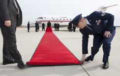 [Canada's Ambassador to the US Gary Doer and Chief of Protocol Capricia Penavic Marshall greet Prime Minister Stephen Harper on his arrival at Andrews Air Force Base in Washington, DC] 4 February 2011