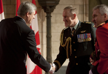 [Prime Minister Stephen Harper shakes hands with Chief of Defence Staff Walter Natynczyk before the Speech from the Throne on Parliament Hill] 3 March 2010