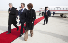[Canada's Ambassador to the US Gary Doer and Chief of Protocol Capricia Penavic Marshall greet Prime Minister Stephen Harper on his arrival at Andrews Air Force Base in Washington, DC] 4 February 2011