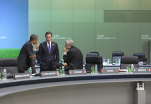 [Prime Minister Stephen Harper chats with US President Barack Obama and British Prime Minister David Cameron before an afternoon plenary session at the G20 Summit in Seoul, South Korea] 11 November 2010