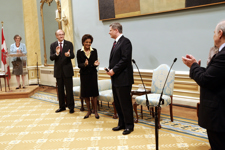 [Jean-Daniel Lafond, Governor General Michaëlle Jean and the Clerk of the Privy Council applaud Stephen Harper after he is sworn in as the 22nd Prime Minister of Canada at Rideau Hall in Ottawa, Ontario] 7 February 2006