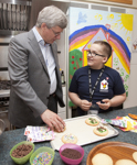 [Prime Minister Stephen Harper and his wife Laureen Harper bake cookies with Michelle and Braxton Wacholtz at Ronald McDonald House in Vancouver, British Columbia] 7 August 2012