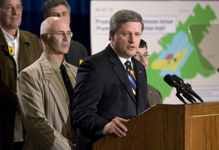 [Prime Minister Stephen Harper announces Ottawa's plan to sell thousands of hectares of land back to farmers during an event in Mirabel, Quebec] 18 December 2006