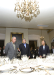 [Prime Minister Stephen Harper, President Felipe Calderón and President George W. Bush take their seats at the Manoir Papineau for a dinner at the North American Leaders' Summit held at Montebello, Quebec] 20 August 2007