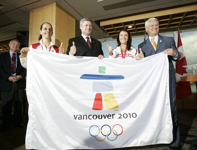 [Prime Minister Stephen Harper holds an Olympic flag with athletes and Premier Gordon Campbell during a funding announcement for the 2010 Vancouver Olympics] 30 August 2006