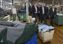 [Prime Minister Stephen Harper, Peter MacKay, Scott Armstrong, Jon Stanfield, President of Stanfield's North America, and Dan Clarke, Vice President Operations, tour the Stanfield's factory after announcing the new Canada 150 Community Infrastructure Program in Truro, Nova Scotia] 15 May 2015
