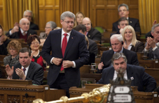 [Prime Minister Stephen Harper stands in the House of Commons during the vote on Bill C-18 (Marketing Freedom for Grain Farmers Act), in Ottawa] 28 November 2011