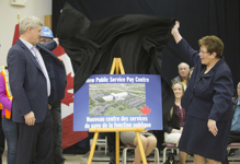 [Prime Minister Stephen Harper and Tilly O'Neill-Gordon, Member of Parliament for Miramichi, New Brunswick, unveil the design of the new Public Service Pay Centre in Miramichi, New Brunswick] 2 April 2015