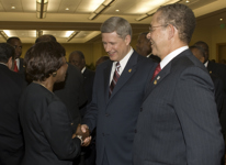 [Prime Minister Stephen Harper chats with Prime Minister of Jamaica Bruce Golding and his wife during a reception at the Summit of the Americas in Port of Spain, Trinidad and Tobago] 17 April 2009