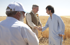 [Prime Minister Stephen Harper greets local farmers during a tour of Tarnak Farm in Kandahar, Afghanistan] 30 May 2011