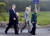 [Prime Minister Stephen Harper and his family walk to an Easter church service in Vimy, France] 8 April 2007