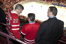 [Prime Minister Stephen Harper attends Canada's women's gold-medal hockey game at the Vancouver Olympics with Gary Lunn and James Moore] 25 February 2010