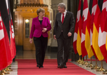 [Prime Minister Stephen Harper walks down the Hall of Honour with Angela Merkel, Chancellor of Germany, on Parliament Hill in Ottawa] 9 February 2015