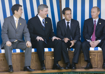 [Japanese Prime Minister Shinzo Abe, Canadian Prime Minister Stephen Harper, French President Nicolas Sarkozy and Russian President Vladimir Putin take their seats for a family photo in Heiligendamm, Germany] 7 June 2007