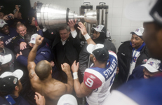 [Prime Minister Stephen Harper lifts the Grey Cup after congratulating the Montréal Alouettes for their win in Edmonton, Alberta] 28 November 2010