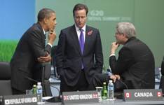 [Prime Minister Stephen Harper chats with US President Barack Obama and British Prime Minister David Cameron before an afternoon plenary session at the G20 Summit in Seoul, South Korea] 11 November 2010