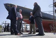 [Prime Minister Stephen Harper is joined by Gerald Keddy, Captain Wayne Walters, Peter Kinley, and Darrel Dexter, Premier of Nova Scotia, as he surveys the restoration work being done on the historic Bluenose II tall ship docked in Lunenburg, Nova Scotia] 18 August 2010
