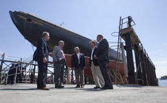 [Prime Minister Stephen Harper is joined by Gerald Keddy, Captain Wayne Walters, Peter Kinley, and Darrel Dexter, Premier of Nova Scotia, as he surveys the restoration work being done on the historic Bluenose II tall ship docked in Lunenburg, Nova Scotia] 18 August 2010