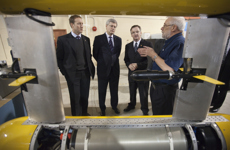 [Prime Minister Stephen Harper is joined by Peter MacKay and Fabian Manning as he is given a demonstration of a research equipment at the National Research Council's Institute for Ocean Technology, in St. John's, Newfoundland] 11 February 2011