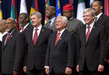[Prime Minister Stephen Harper poses for the group photo at the Commonwealth Heads of Government Meeting in Trinidad and Tobago] 27 November 2009