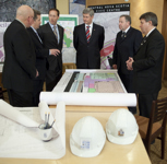 [Prime Minister Stephen Harper is joined by Bob Taylor, Mayor of the Municipality of the County of Colchester, Scott Armstrong, Peter MacKay, Darrel Dexter, Premier of Nova Scotia, and Bill Mills, Mayor of Truro, as he surveys building plans for the Central Nova Scotia Civic Centre in Truro, Nova Scotia] 21 January 2010