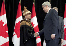 [Prime Minister Stephen Harper is greeted by Shawn A-in-chut Atleo, National Chief of the Assembly of First Nations, during the Crown-First Nations Gathering in Ottawa, Ontario] 24 January 2012
