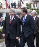 [Prime Minister Stephen Harper walks to the opening session with British Prime Minister David Cameron at the G8 Summit in Deauville, France] 26 May 2011