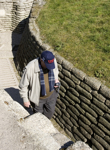 [An elderly man wearing a Vimy hat walks through the trenches at the Vimy Memorial National Historic Site in Vimy, France] 8 April 2007