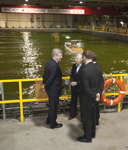 [Prime Minister Stephen Harper is joined by Peter MacKay and Fabian Manning as he is given a demonstration of a research tank by Dr. Mary Williams, Director General of the National Research Council's Institute for Ocean Technology, in St. John's, Newfoundland] 11 February 2011