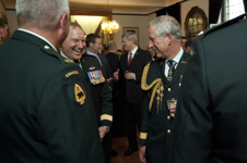 [Chief of Defence Staff General Walter Natynczyk and His Royal Highness the Prince of Wales chat with members of the Canadian military at the Fort York Armoury in Toronto] 22 May 2012