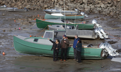 [Chuck Strahl, Nunavut Premier Eva Aariak, Prime Minister Stephen Harper and Leona Aglukkaq walk around the existing inlet prior to announcing plans to build a new modern harbour in Pangnirtung, Nunavut] 20 August 2009