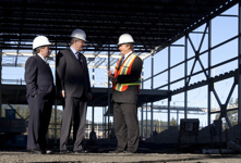 [Prime Minister Stephen Harper is joined by Gary Lunn and Stewart Young, Mayor of Langford, as he is given a tour of the City Centre Park Sportsplex, in Langford, British Columbia] 22 February 2011