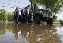 [Prime Minister Stephen Harper visits the disaster areas together with Christian Paradis, Minister of Industry, Robert Dutil, Quebec Minister of Public Security and Lieutenant-Colonel Simon Bernard of the Canadian Armed Forces in the Richelieu River valley, Quebec] 6 June 2011